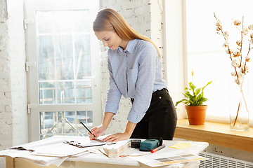 Image showing Interior designer working with colour palette in modern office