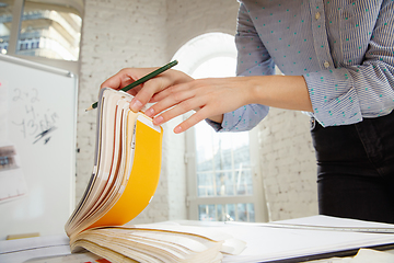 Image showing Interior designer working with colour palette in modern office