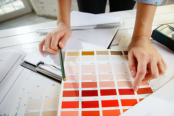 Image showing Interior designer working with colour palette in modern office