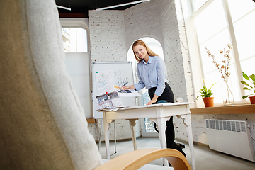 Image showing Interior designer working with colour palette in modern office