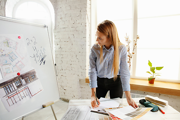 Image showing Interior designer working with colour palette in modern office