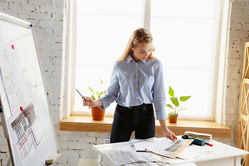 Image showing Interior designer working with colour palette in modern office