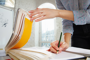 Image showing Interior designer working with colour palette in modern office