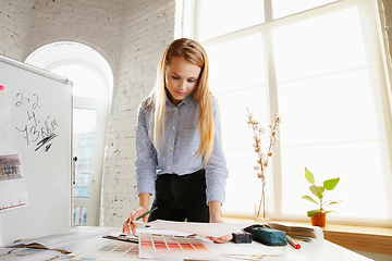 Image showing Interior designer working with colour palette in modern office