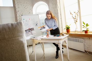 Image showing Interior designer working with colour palette in modern office