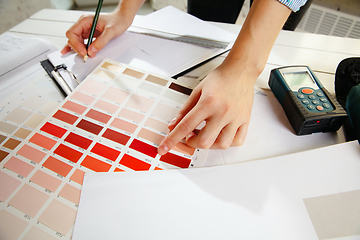 Image showing Interior designer working with colour palette in modern office