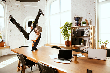 Image showing Businessman having fun dancing break dance in the office at work