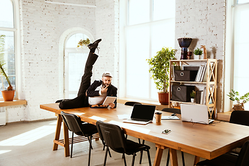 Image showing Businessman having fun dancing break dance in the office at work