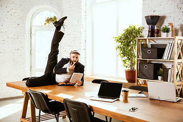 Image showing Businessman having fun dancing break dance in the office at work