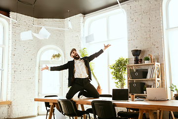 Image showing Businessman having fun dancing break dance in the office at work