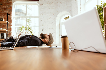 Image showing Businessman having fun dancing break dance in the office at work