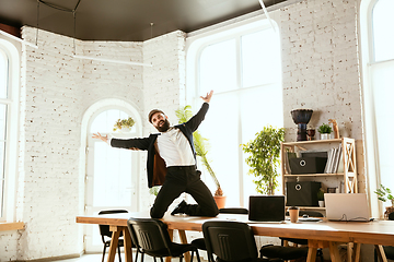 Image showing Businessman having fun dancing break dance in the office at work