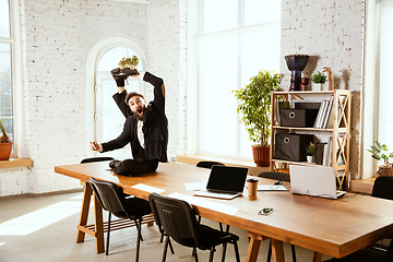 Image showing Businessman having fun dancing break dance in the office at work