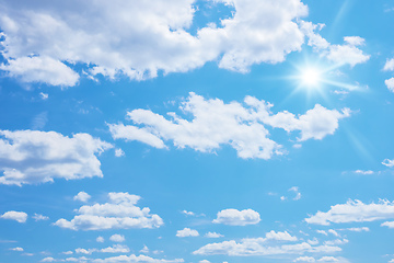 Image showing blue sky with sun and clouds background