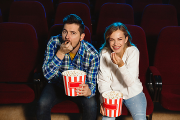 Image showing Attractive young caucasian couple watching a film at a movie theater