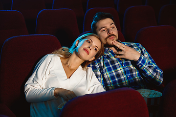 Image showing Attractive young caucasian couple watching a film at a movie theater