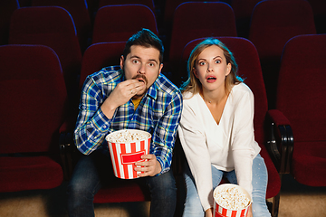 Image showing Attractive young caucasian couple watching a film at a movie theater