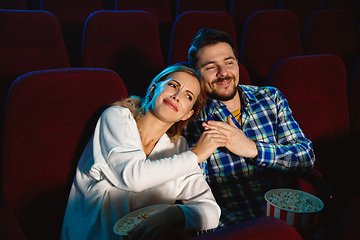 Image showing Attractive young caucasian couple watching a film at a movie theater