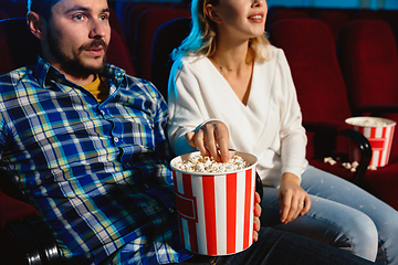 Image showing Attractive young caucasian couple watching a film at a movie theater