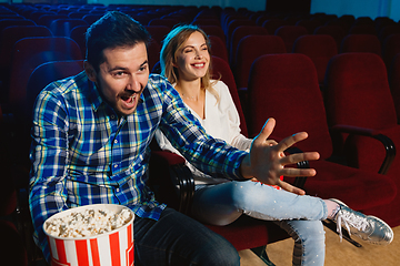 Image showing Attractive young caucasian couple watching a film at a movie theater