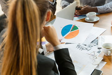 Image showing Group of young business professionals having a meeting, creative office