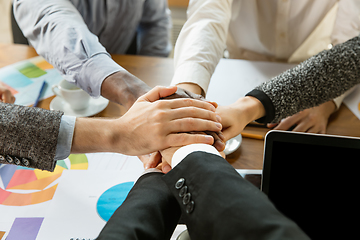 Image showing Group of young business professionals having a meeting, creative office