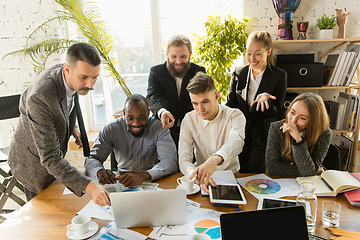 Image showing Group of young business professionals having a meeting, creative office