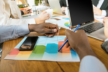 Image showing Group of young business professionals having a meeting, creative office