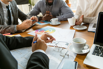 Image showing Group of young business professionals having a meeting, creative office