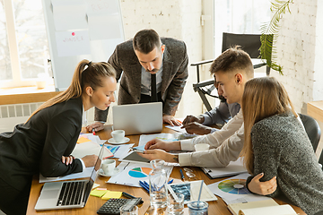 Image showing Group of young business professionals having a meeting, creative office