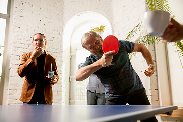 Image showing Young people playing table tennis in workplace, having fun