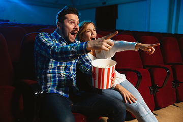 Image showing Attractive young caucasian couple watching a film at a movie theater