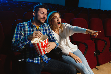 Image showing Attractive young caucasian couple watching a film at a movie theater