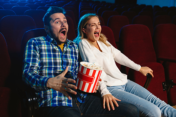 Image showing Attractive young caucasian couple watching a film at a movie theater