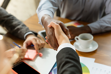 Image showing Group of young business professionals having a meeting, creative office