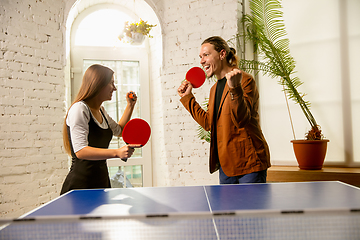 Image showing Young people playing table tennis in workplace, having fun