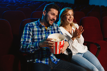 Image showing Attractive young caucasian couple watching a film at a movie theater