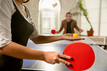 Image showing Young people playing table tennis in workplace, having fun