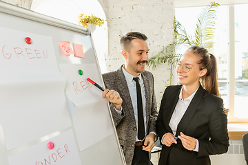 Image showing Young business professionals having a meeting, creative office