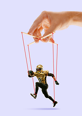 Image showing Man like a puppet in somebodies hands. Concept of manipulation