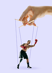 Image showing Man like a puppet in somebodies hands. Concept of manipulation