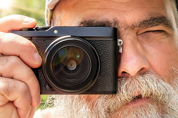 Image showing older man with his camera