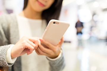 Image showing Woman working on cellphone