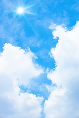 Image showing typical blue sky with sun and clouds background