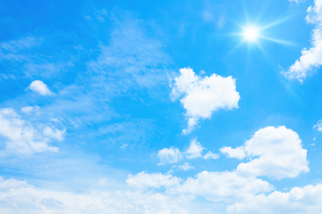 Image showing typical blue sky with sun and clouds background