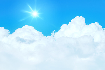 Image showing typical blue sky with sun and clouds background