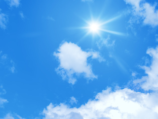 Image showing typical blue sky with sun and clouds background