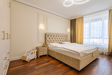 Image showing Beige colored modern bedroom interior with double bed