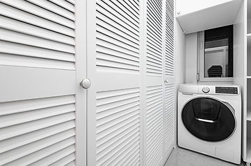 Image showing White utility room with big closet in new apartment