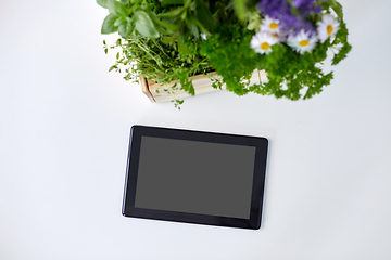 Image showing tablet computer with herbs and flowers in box